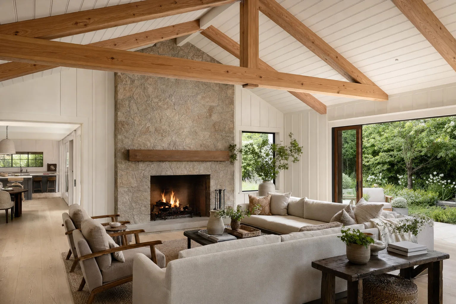 Great room with exposed Douglas fir beams and a stone fireplace — representative image